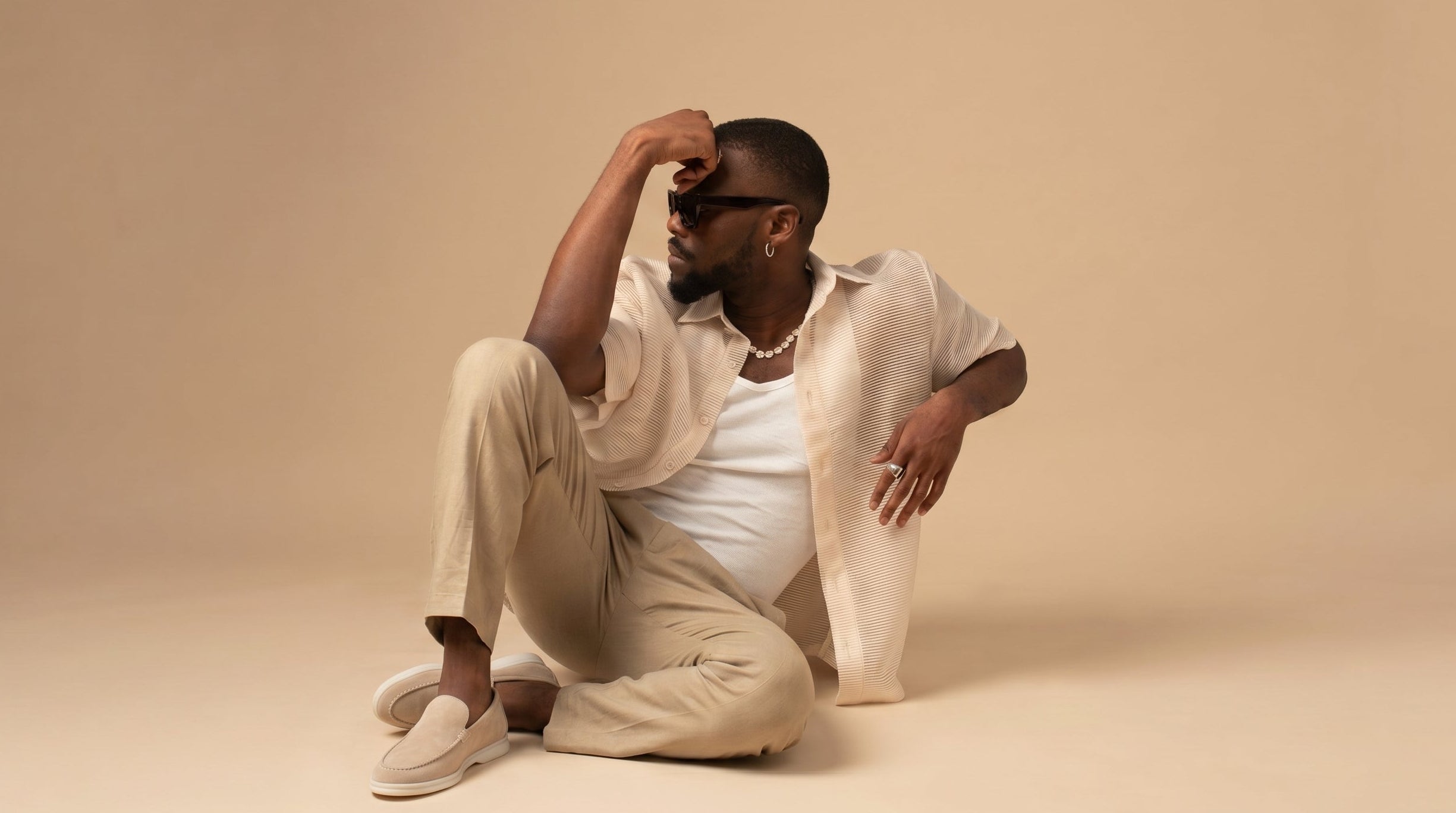 Ballian signature collection, man in casual linen outfit, neutral background